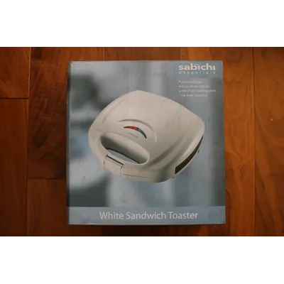 Rent Sandwich Toaster with Non stick interior coating and Glossy white plastic 